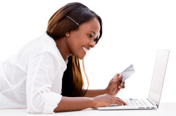 Woman paying online with a credit card - isolated over white
